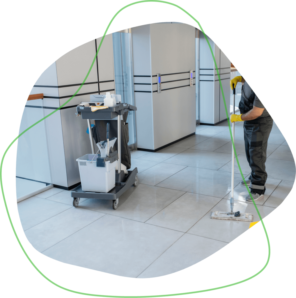 A professional cleaner providing commercial cleaning services to a local San Antonio office building